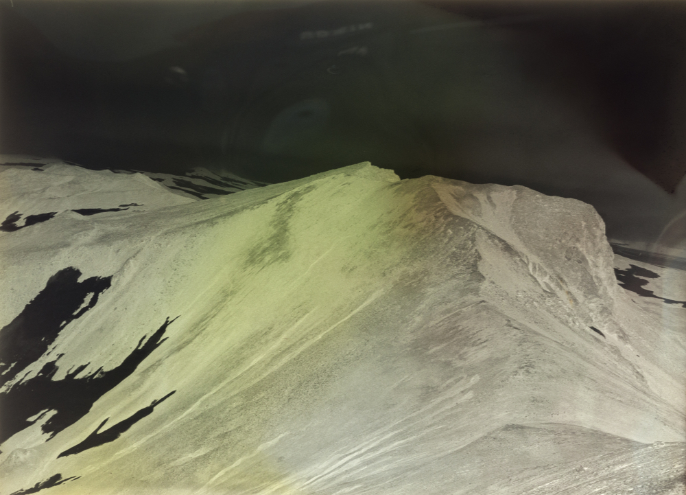 Negative image of Jan Mayen, showing coloured chemical swirls